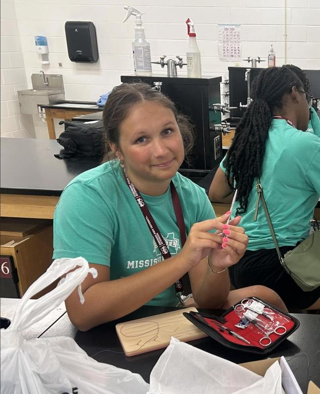 Kara working a lab
