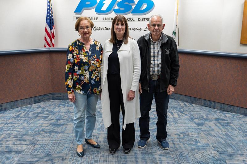 Rebecca Silvas poses with guests at the PUSD Board meeting following her recognition as a Monache High School honoree.