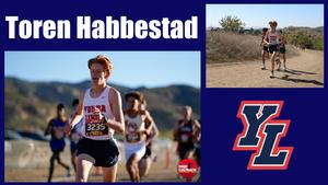 A young male cross-country runner in a "Yorba" jersey competes on a sunny trail. Background shows blurred runners and a mountainous landscape. YL logo present.