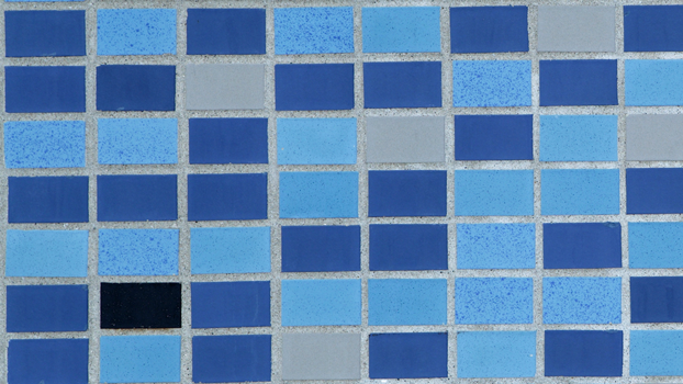 Photo of iconic NEST+m mosaic tiles that cover the exterior walls.