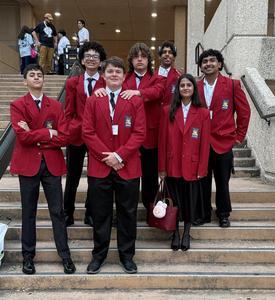 Memorial high school SkillsUSA students standing on a staircase with their state medals