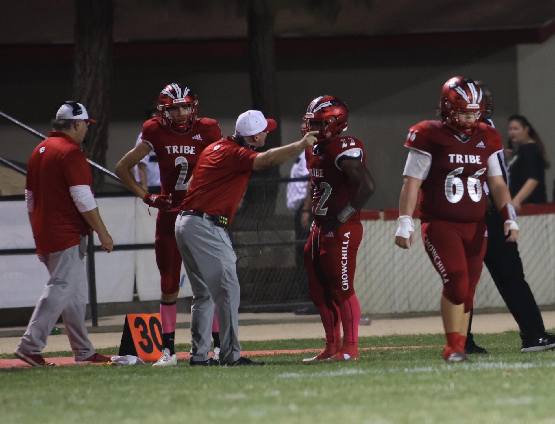 varsity boys playing football against Fowler