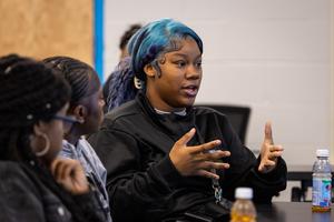 A student speaks during the forum