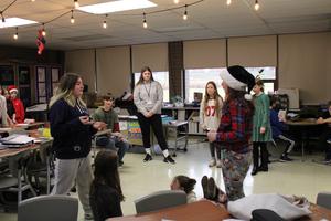 Intermediate students acting with high schoolers watching