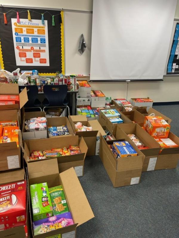 52 boxes packed with snack for the Found Mission food pantry donation.