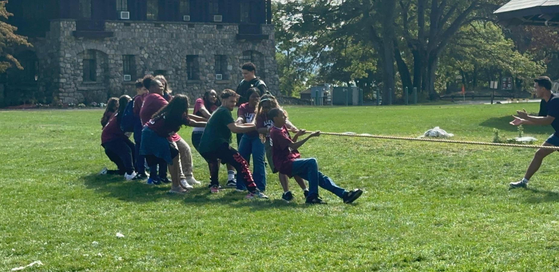 Students in a tug of war during community building trip.