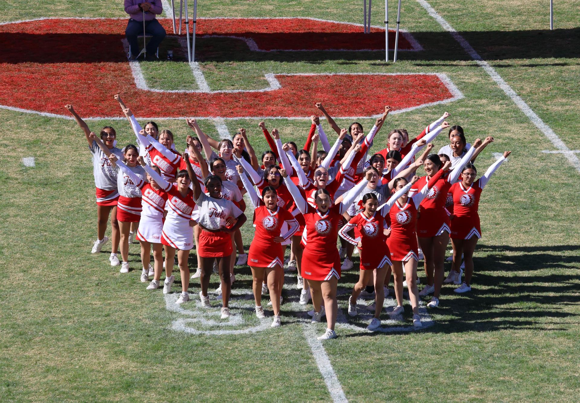 students and staff at the homecoming rally