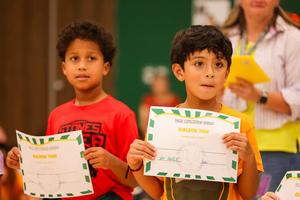 Image of students getting awards at pack celebration.