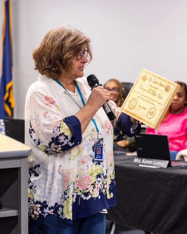 Xaiveyon presented with award by Ms. Arthrell