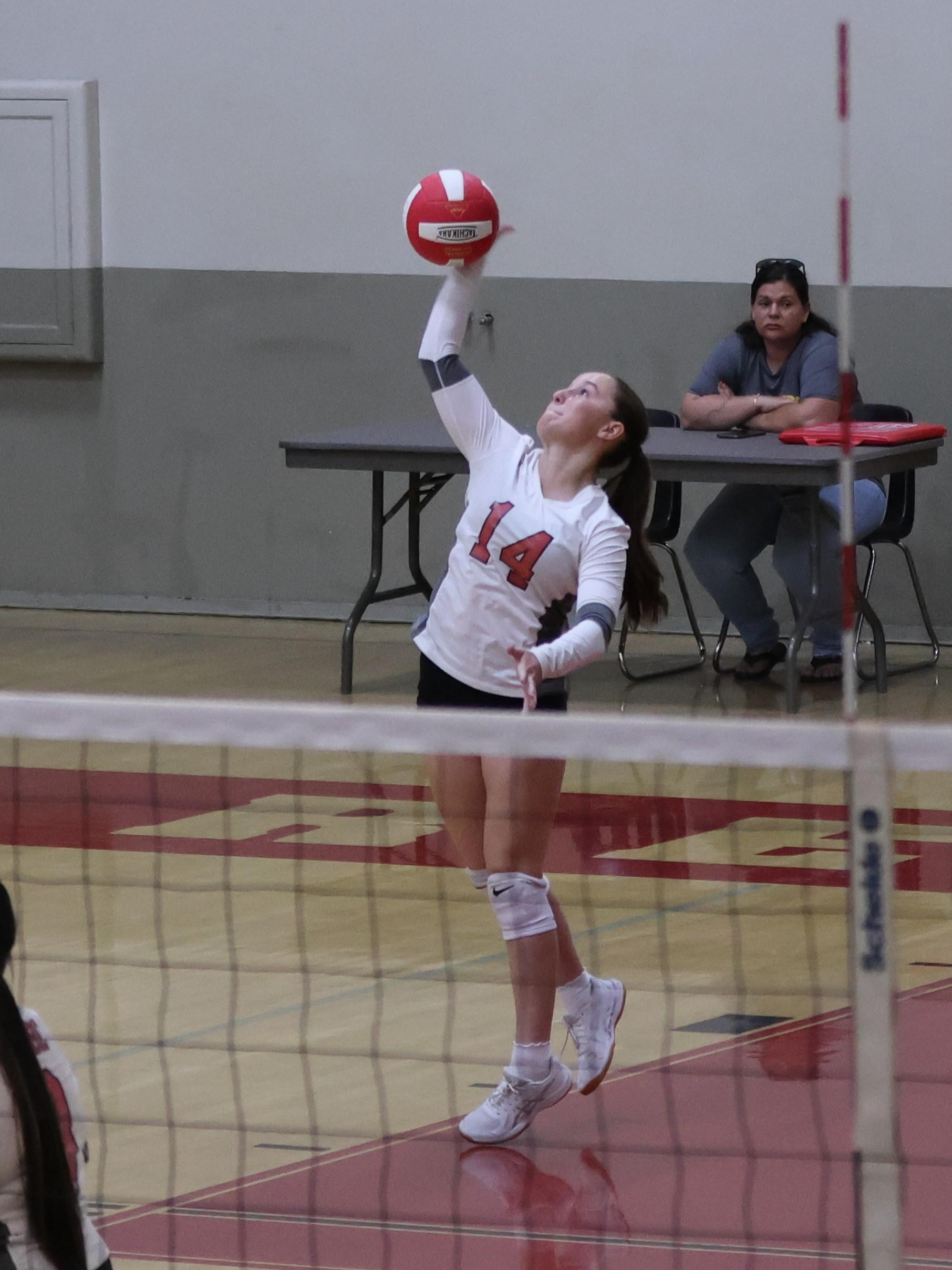 junior varsity girls playing volleyball 130