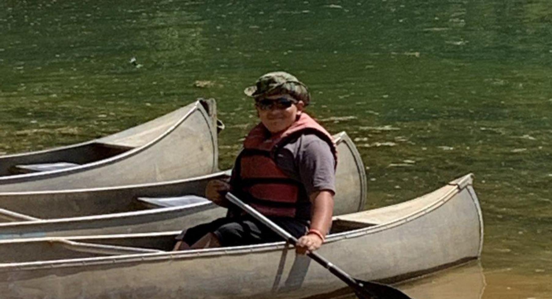Student in a canoe.