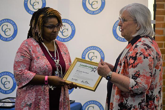 Ann Davis is presented her award by board president Joan Manning
