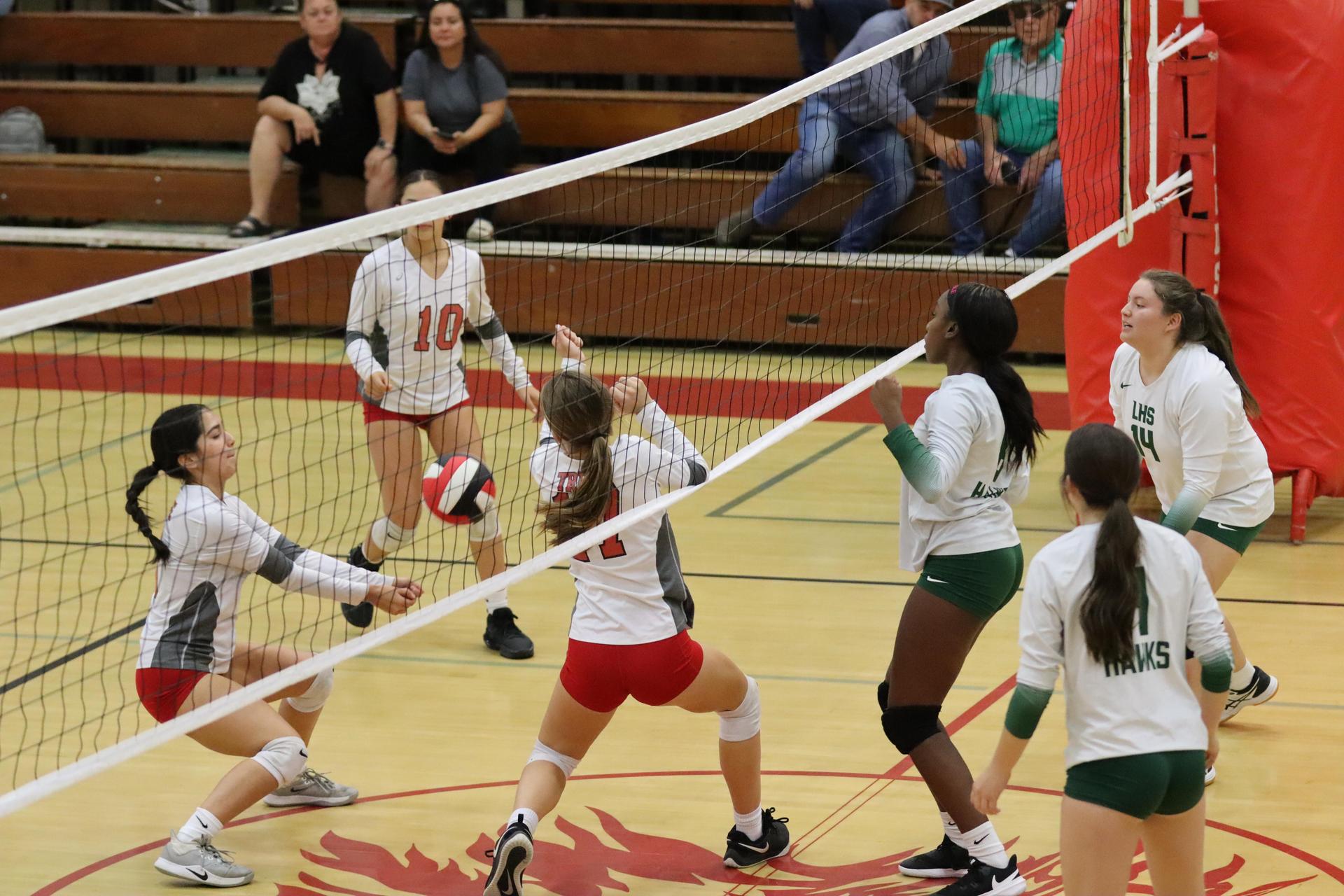 junior varsity girls playing volleyball against Liberty