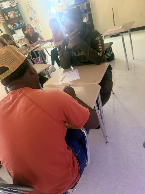 Picture 3 of two students talking