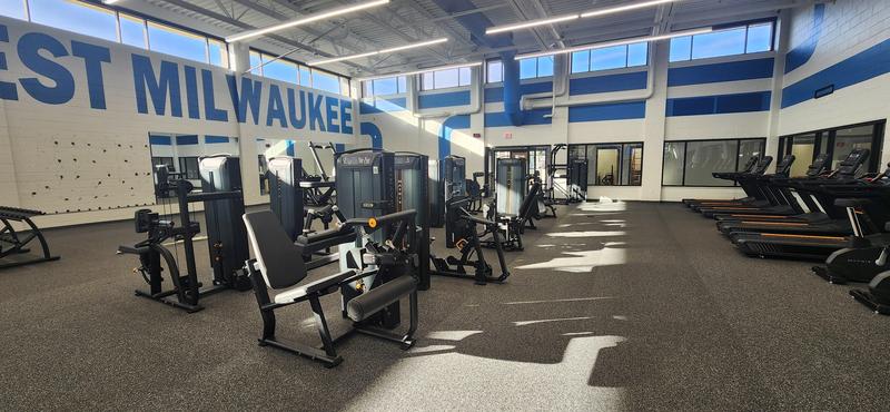 fitness center in afternoon lighting featuring new equipment for fitness