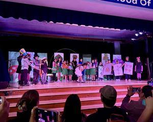 Students acting on stage