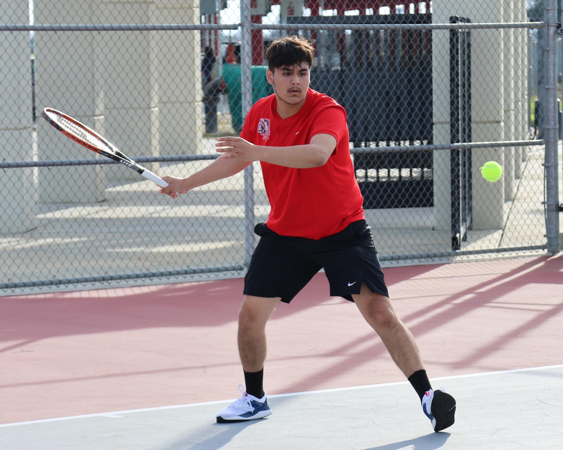 CUHS Boys playing tennis against coalinga