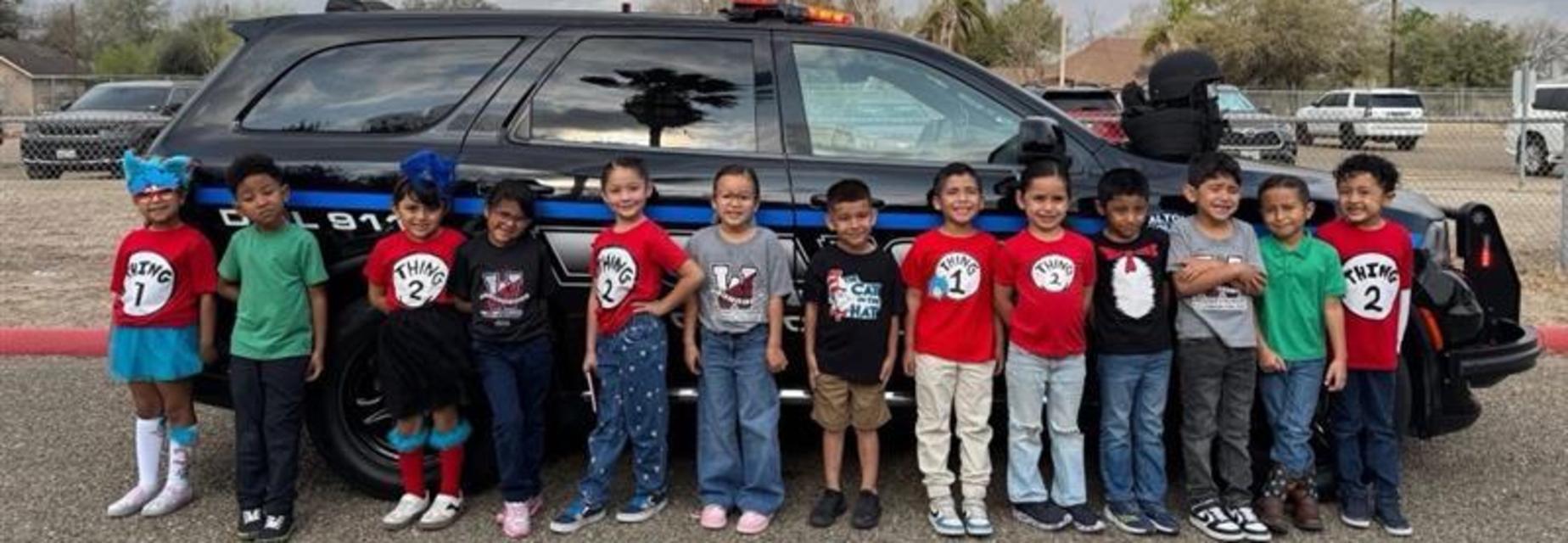 kinder with police car