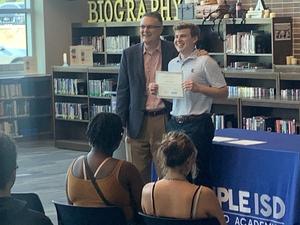 Blake Thomas is recognized as the student with the highest combined score across IB and AP exams
