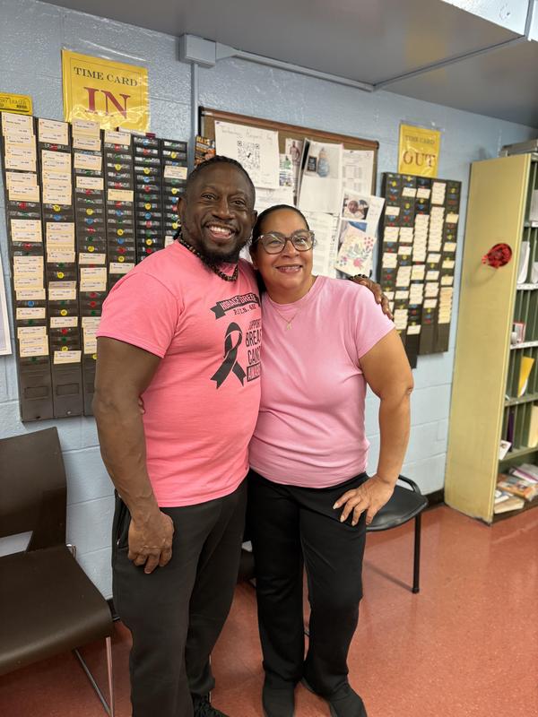 Staff members in pink tops