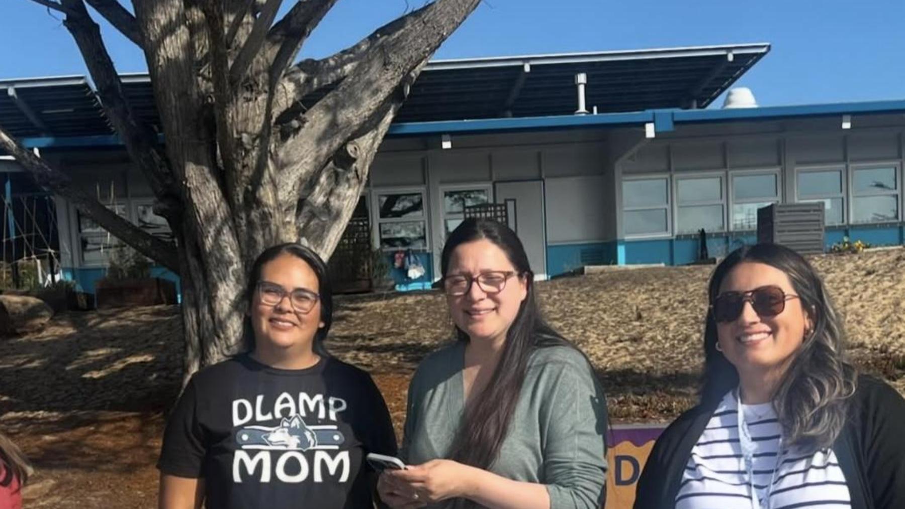 PTA board members and liaison pose for photo during open house 2025