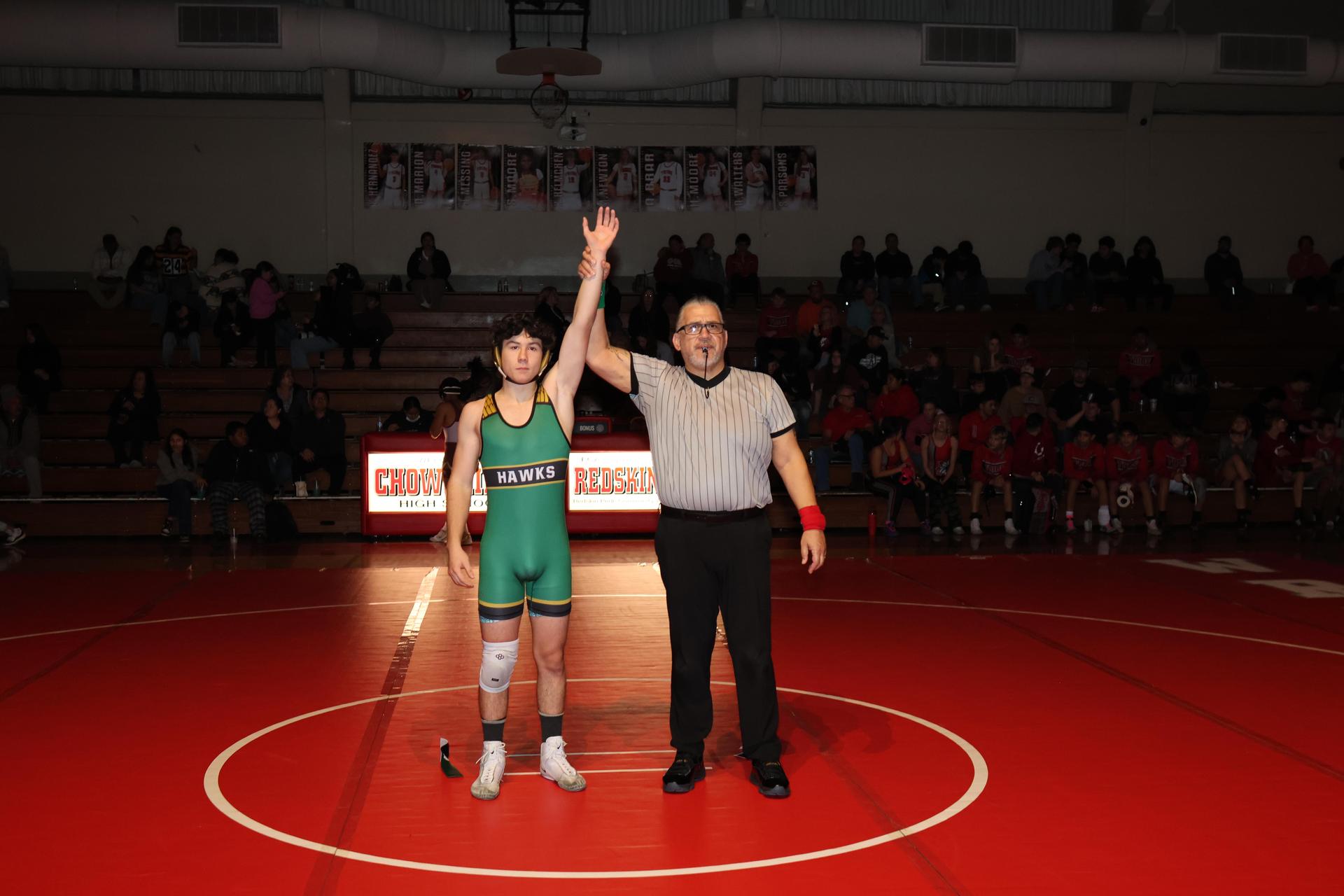 Wrestling winners with hands up 65