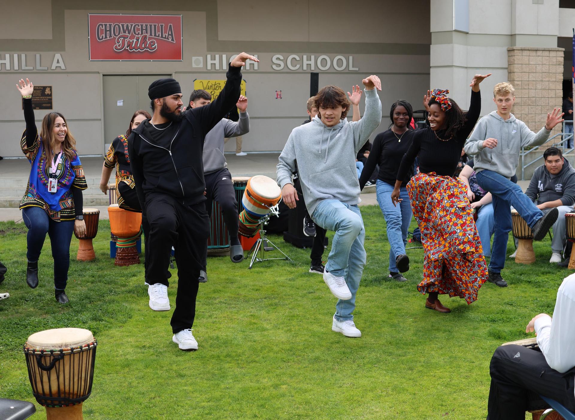 students and staff participating with the African Drum Interactive