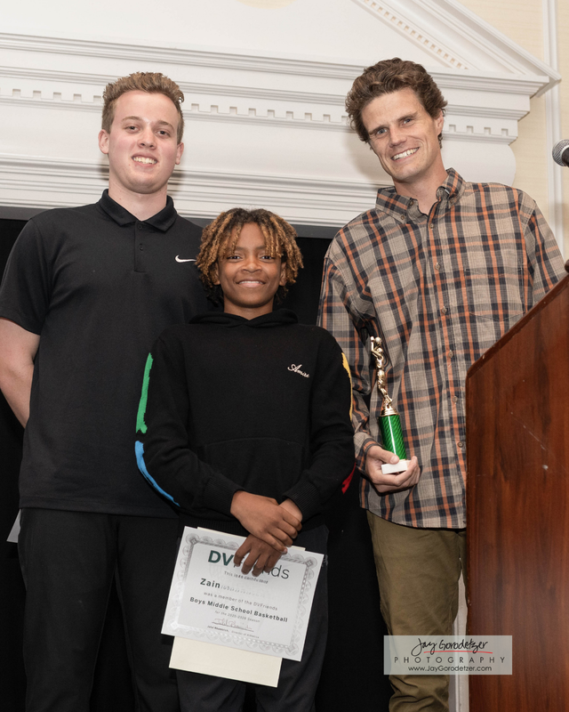 Student Receiving award from Coach