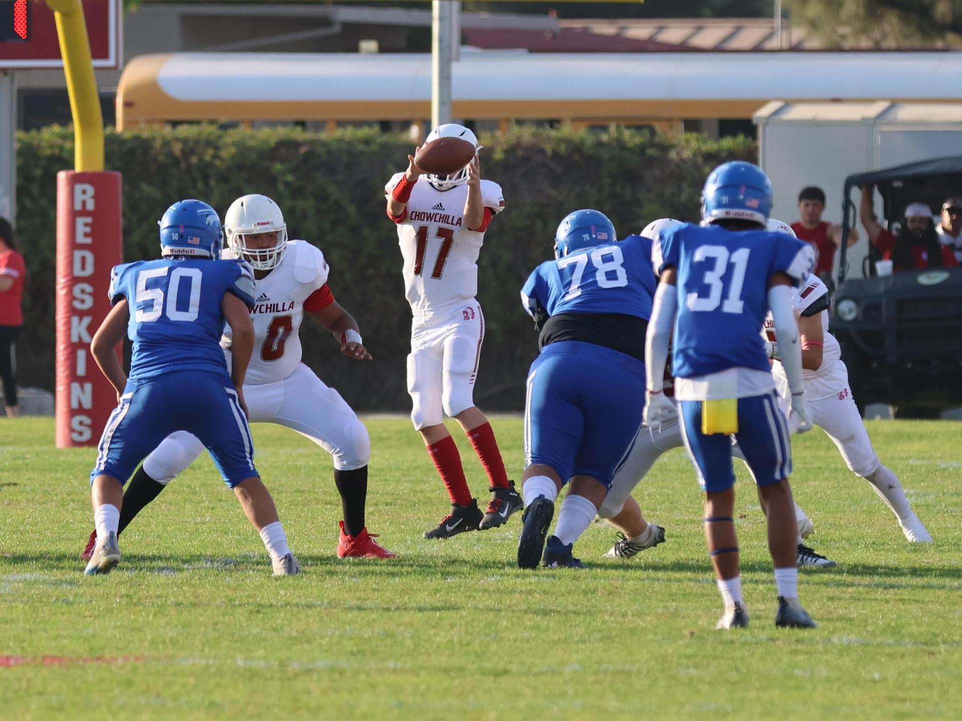 Junior Varsity football players in action against Caruthers