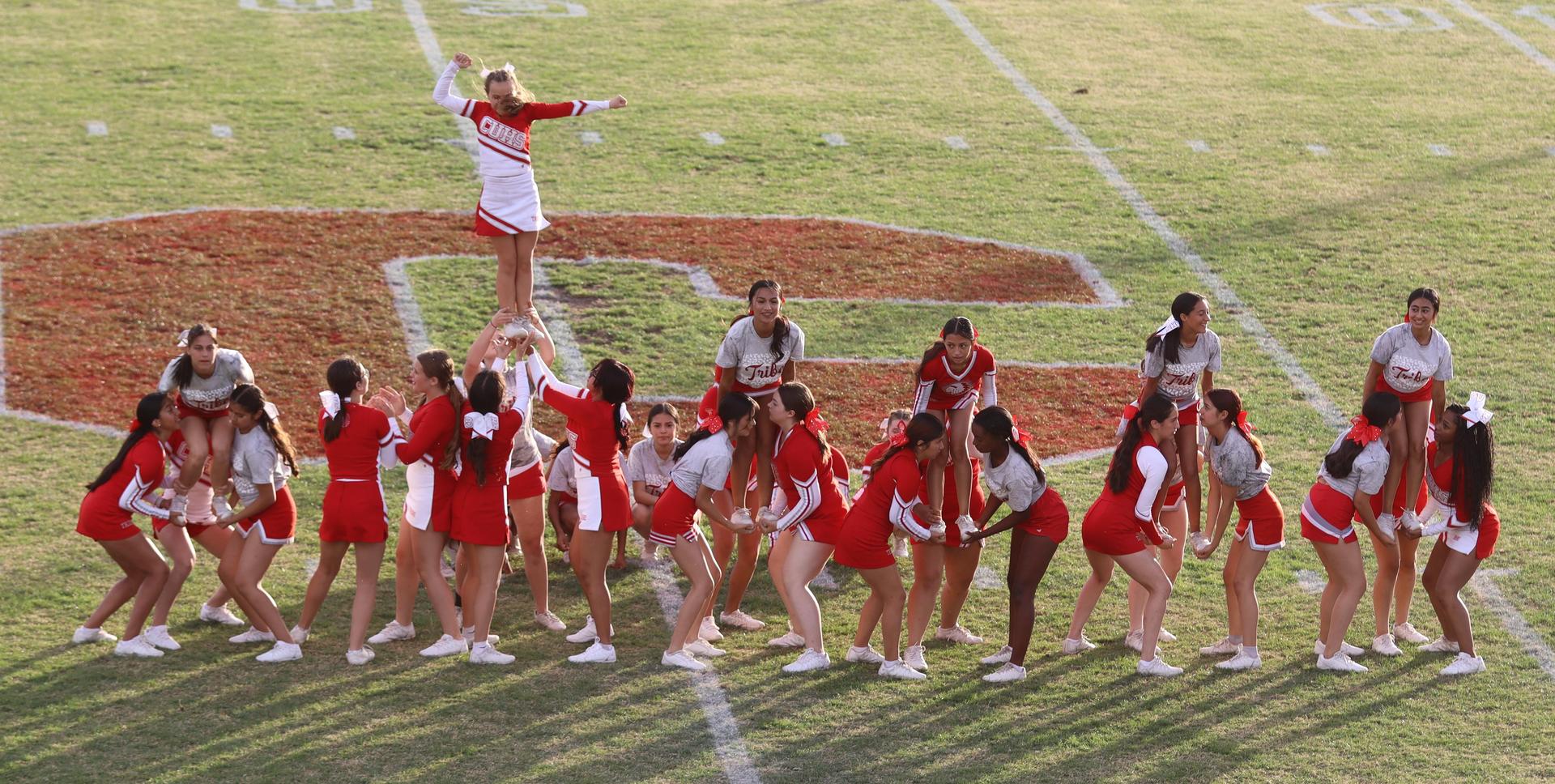 Combined cheer performing at halftime of the football game