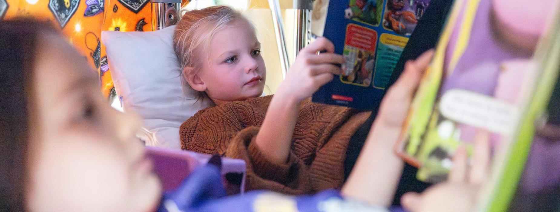 students reading in a fort