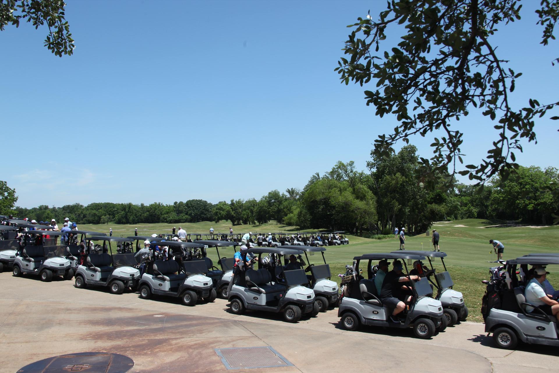 Golf carts lined up before the tournament at Split Rail. 
