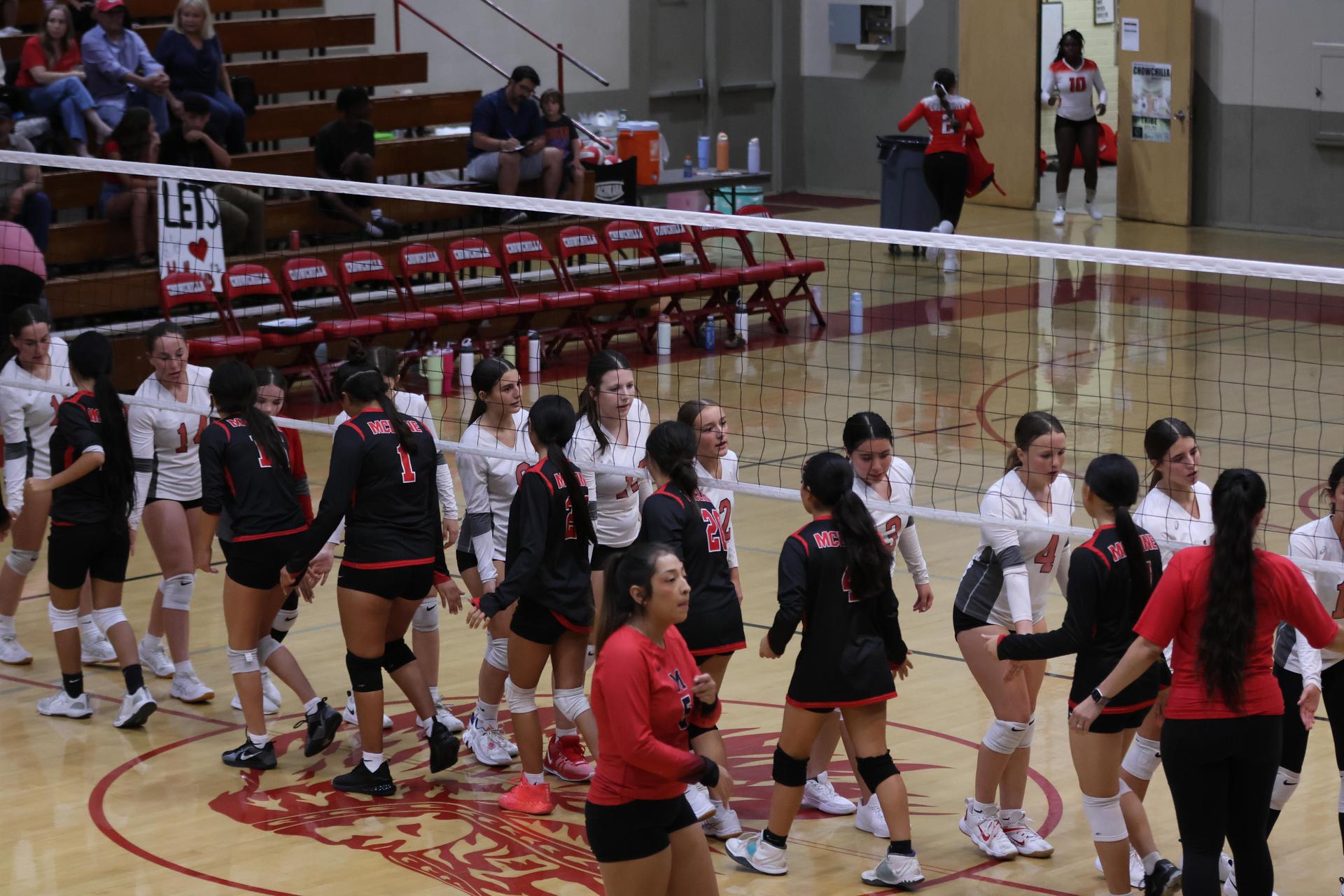 junior varsity girls playing volleyball 137