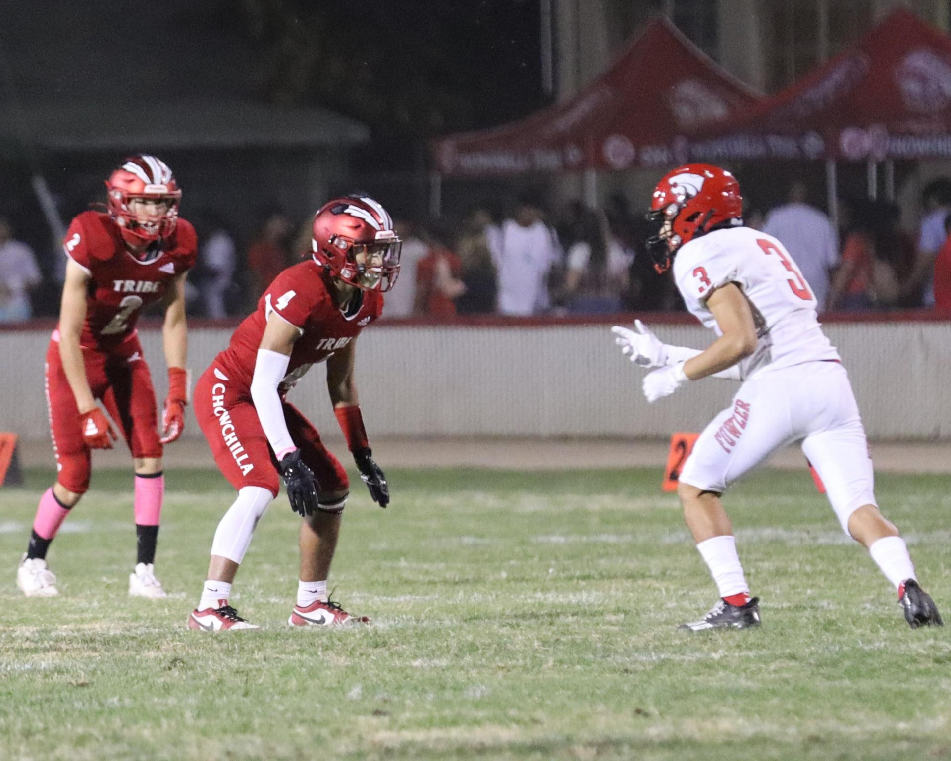 varsity boys playing football against Fowler