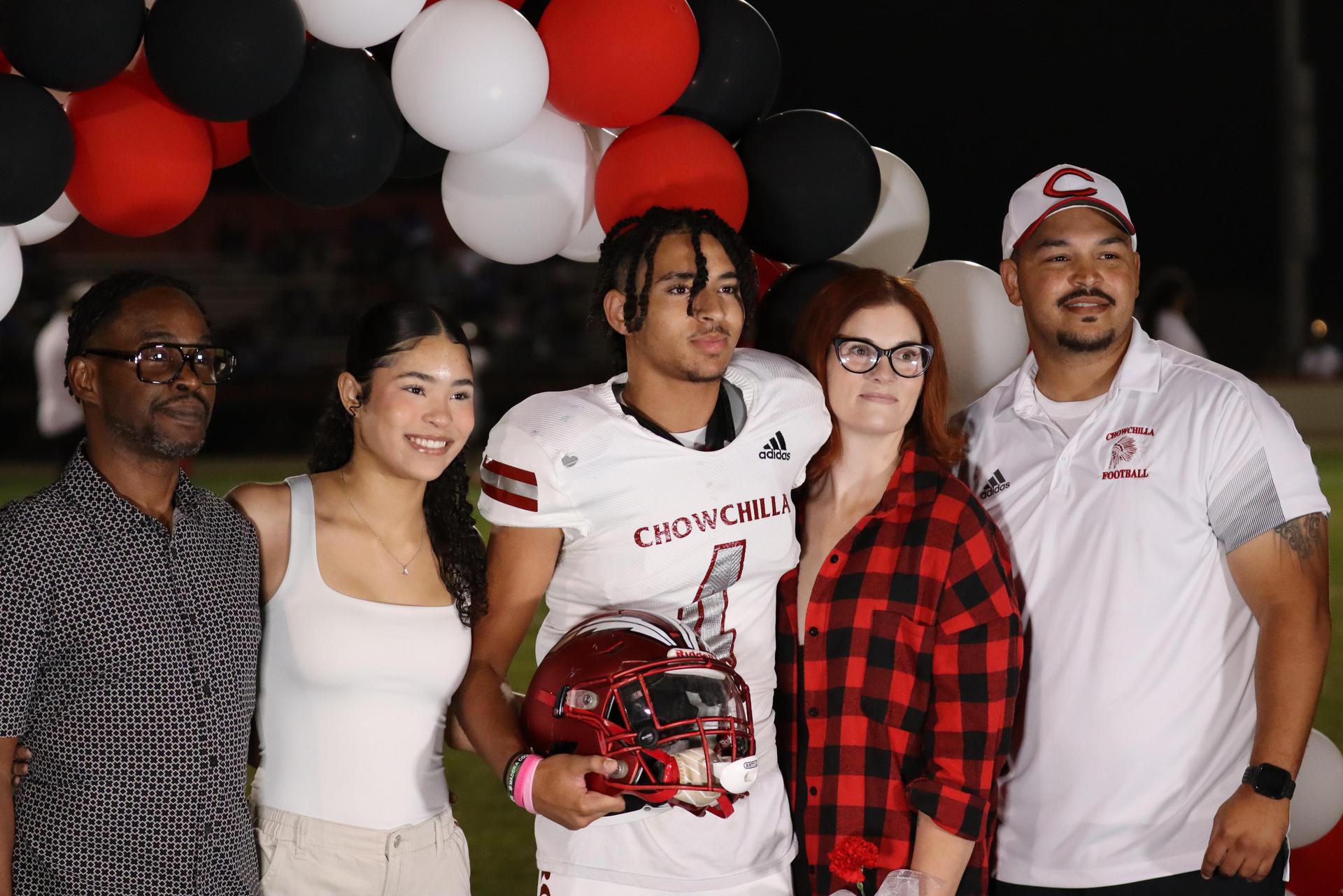 seniors and their escorts celebrating senior night
