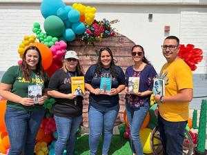 educator hold up books for CCL