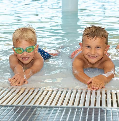 Two boys in shallow end of pool