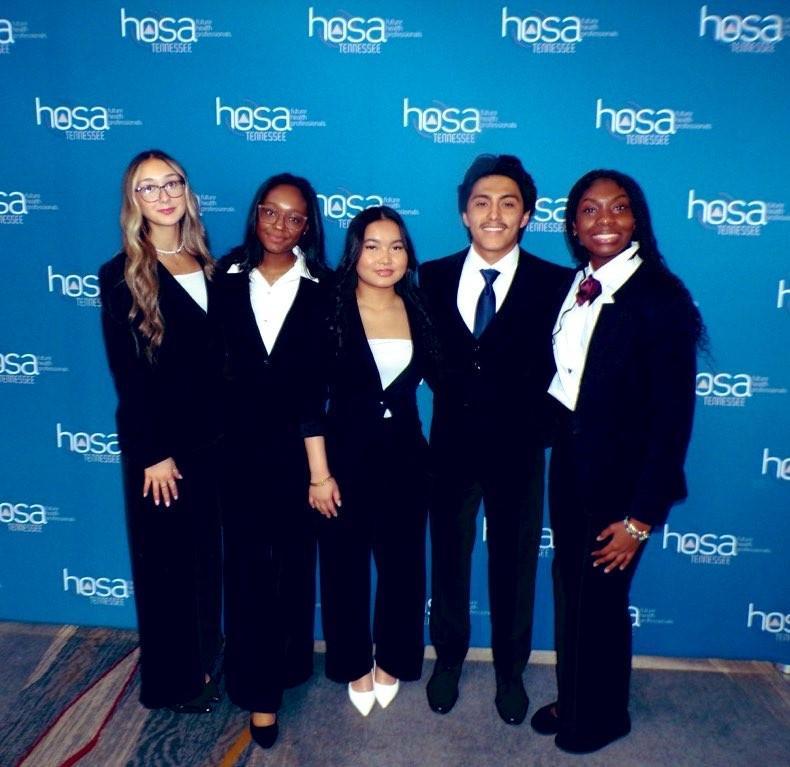 Smiling teens dressed in professional attire