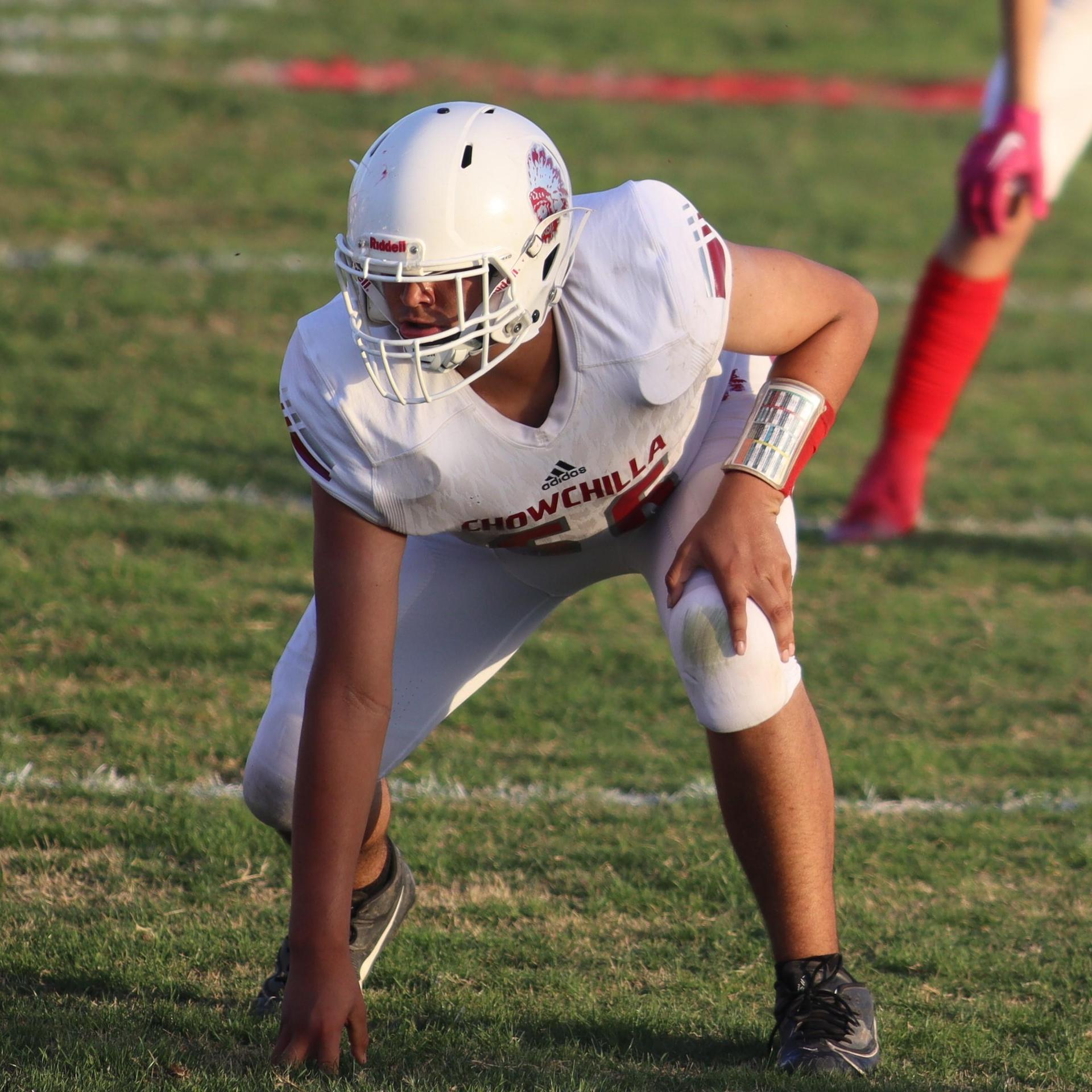 Junior Varsity football players in action against Caruthers