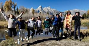 Kids in the Tetons jumping in the air
