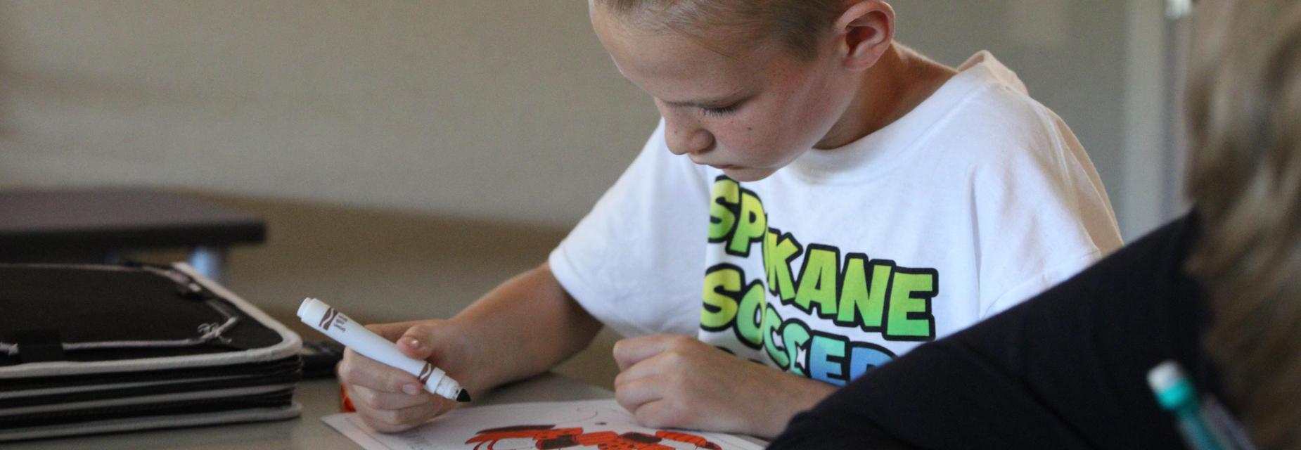 student coloring paper