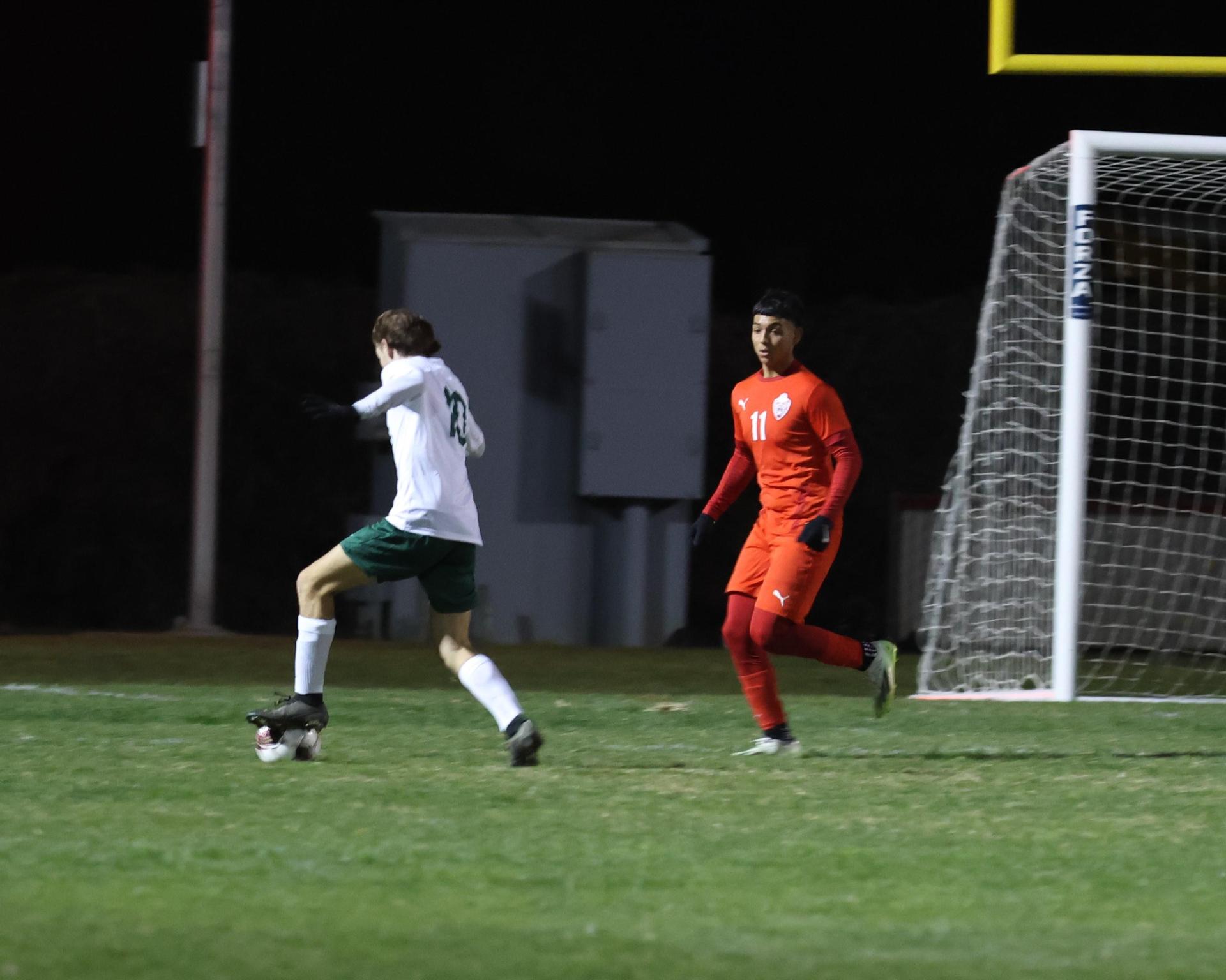 Varsity boys play soccer against Kingsburg