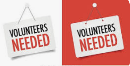 Poster hanging askew saying "Volunteers needed"