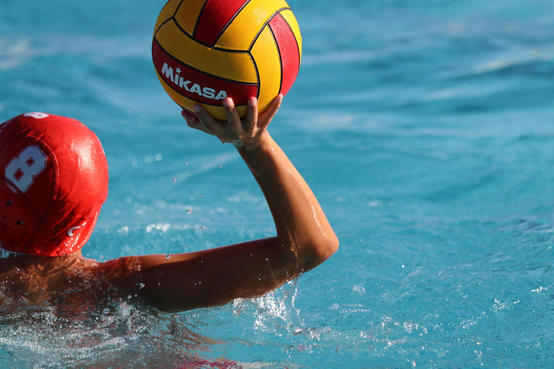 boys playing water polo against Madera