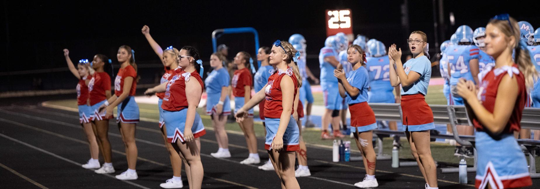 cheerleaders at the game - nighttime