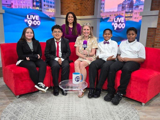 Students participate in a television studio interview.
