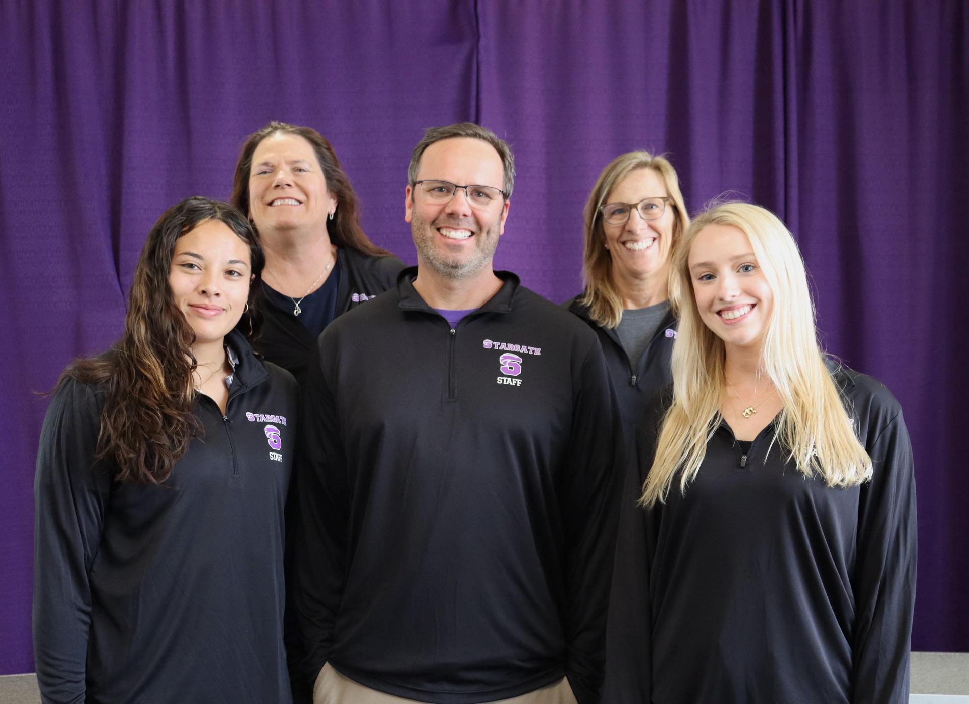 The fifth grade teachers smiling for a picture.