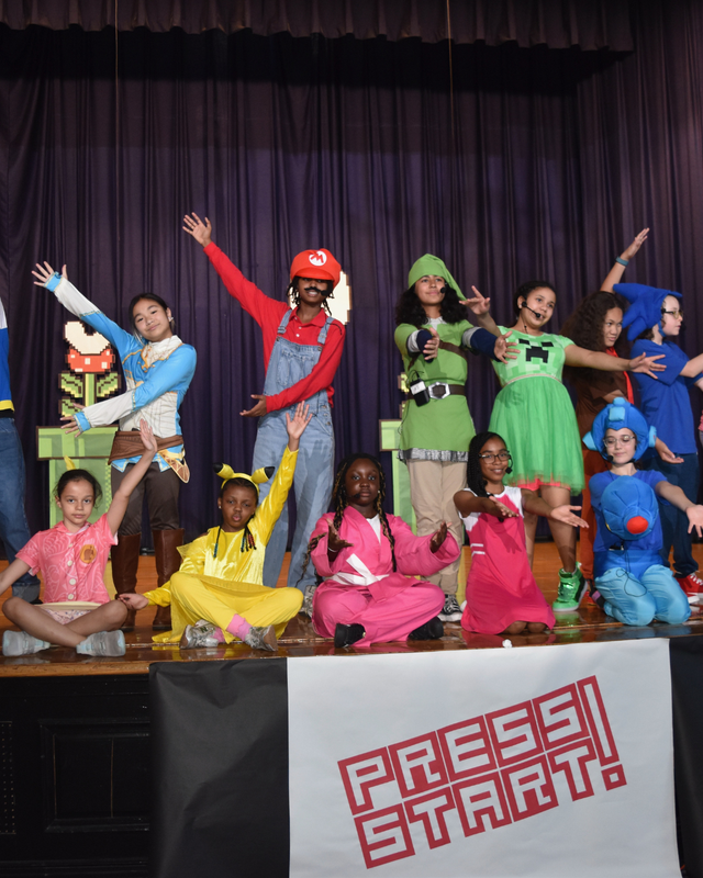 Full cast picture of students in video game charactercostumes