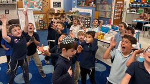 The kindergarten boys catch sight-words in their snowing sight word game!