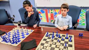 Boys competing at chess